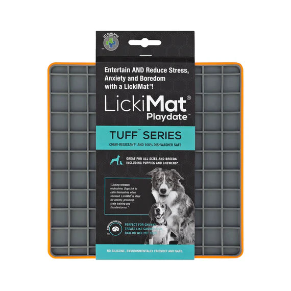 LickiMat Playdate Tuff Orange with dog licking
