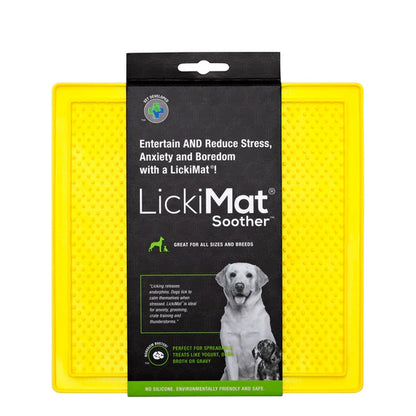 LickiMat Pastel Soother Yellow with dog licking