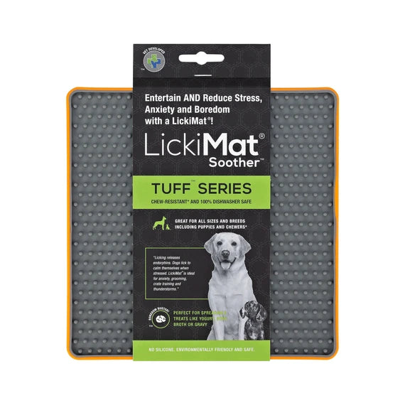 LickiMat Soother Tuff Orange with dog licking