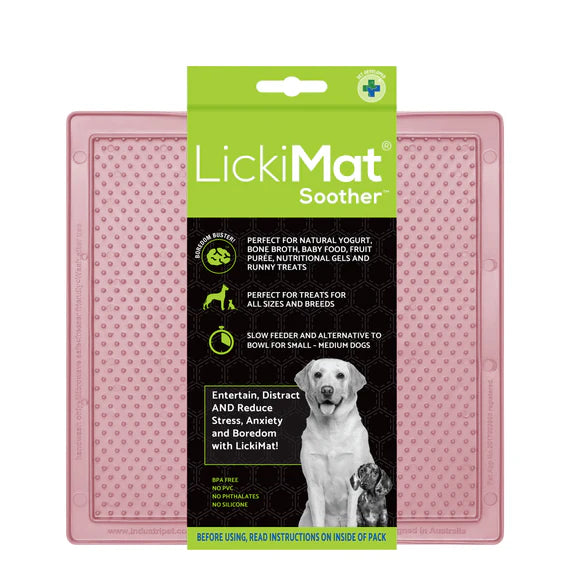 LickiMat Pastel Soother Guava with dog licking