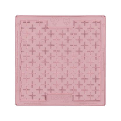 LickiMat Pastel Buddy Guava with dog licking
