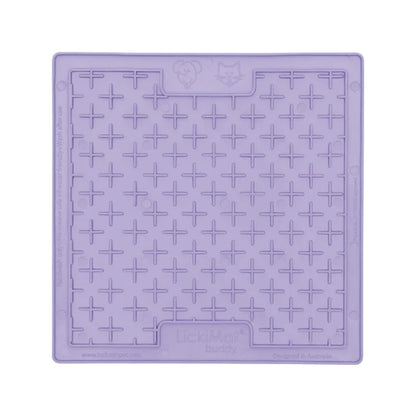 LickiMat Pastel Buddy Lavender with dog licking