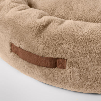 MiniJumbuk Sleep Calm Oasis Fawn – dog lying in bed